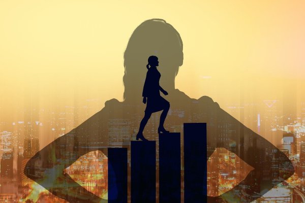 Silhouette of a person climbing upward on bar chart steps, symbolizing growth and progress, with a city skyline and warm golden background.